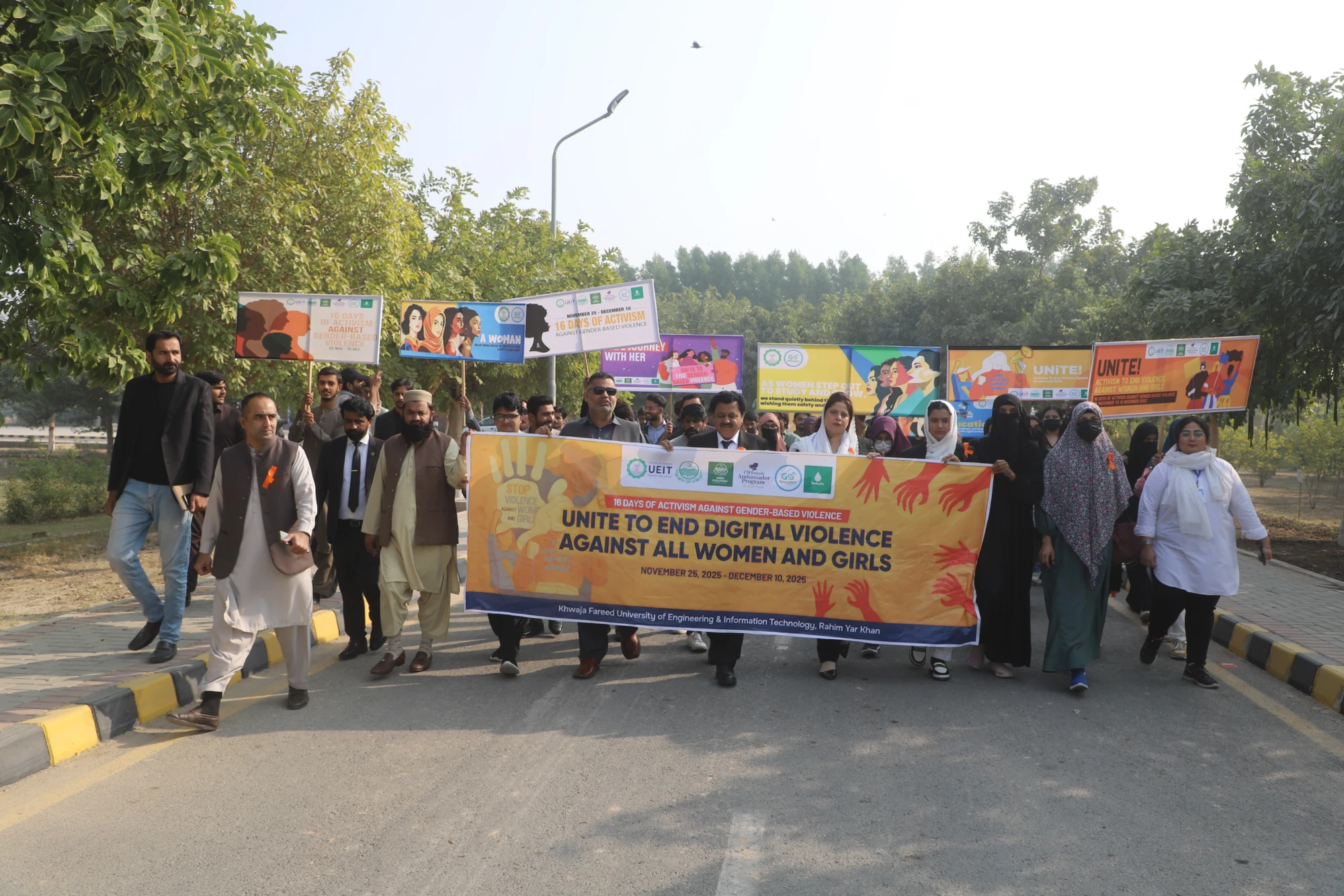 A walk is underway at Khawaja Fareed University, with faculty and students joining to spread awareness as part of a campaign against digital violence faced by women